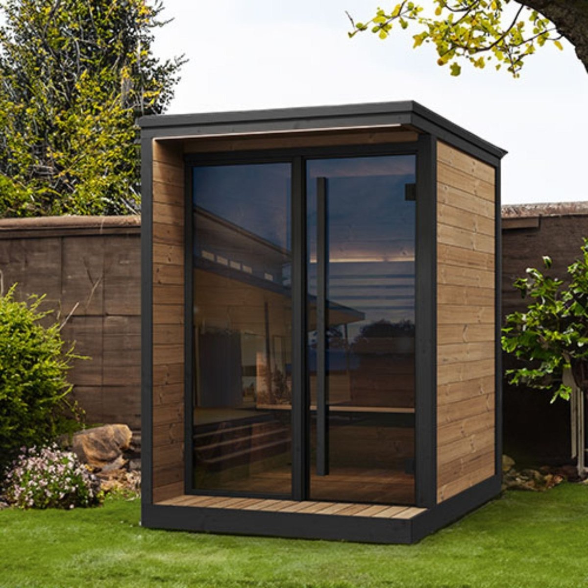 SaunaLife GL4 outdoor sauna cabin positioned in landscaped garden.