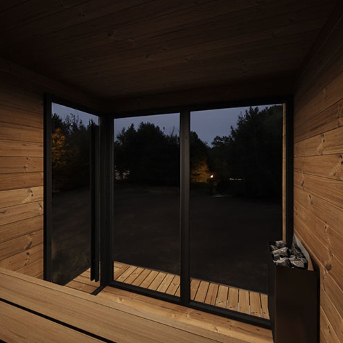 SaunaLife GL6 interior with large glass windows overlooking the outdoors.