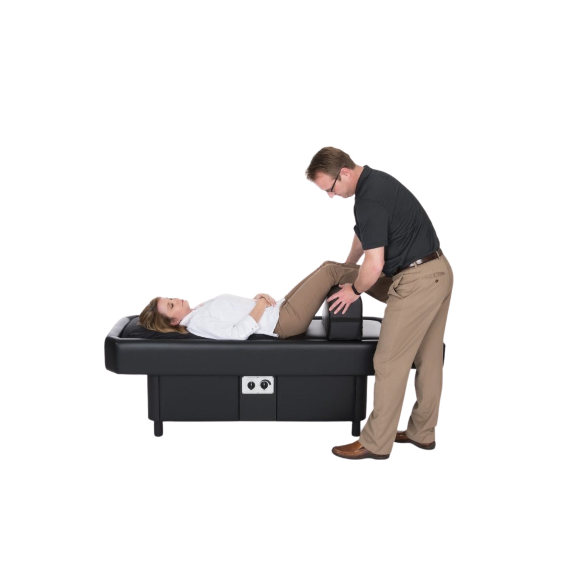 Patient lying on Sidmar Hydrotable with bolster placed for leg support
