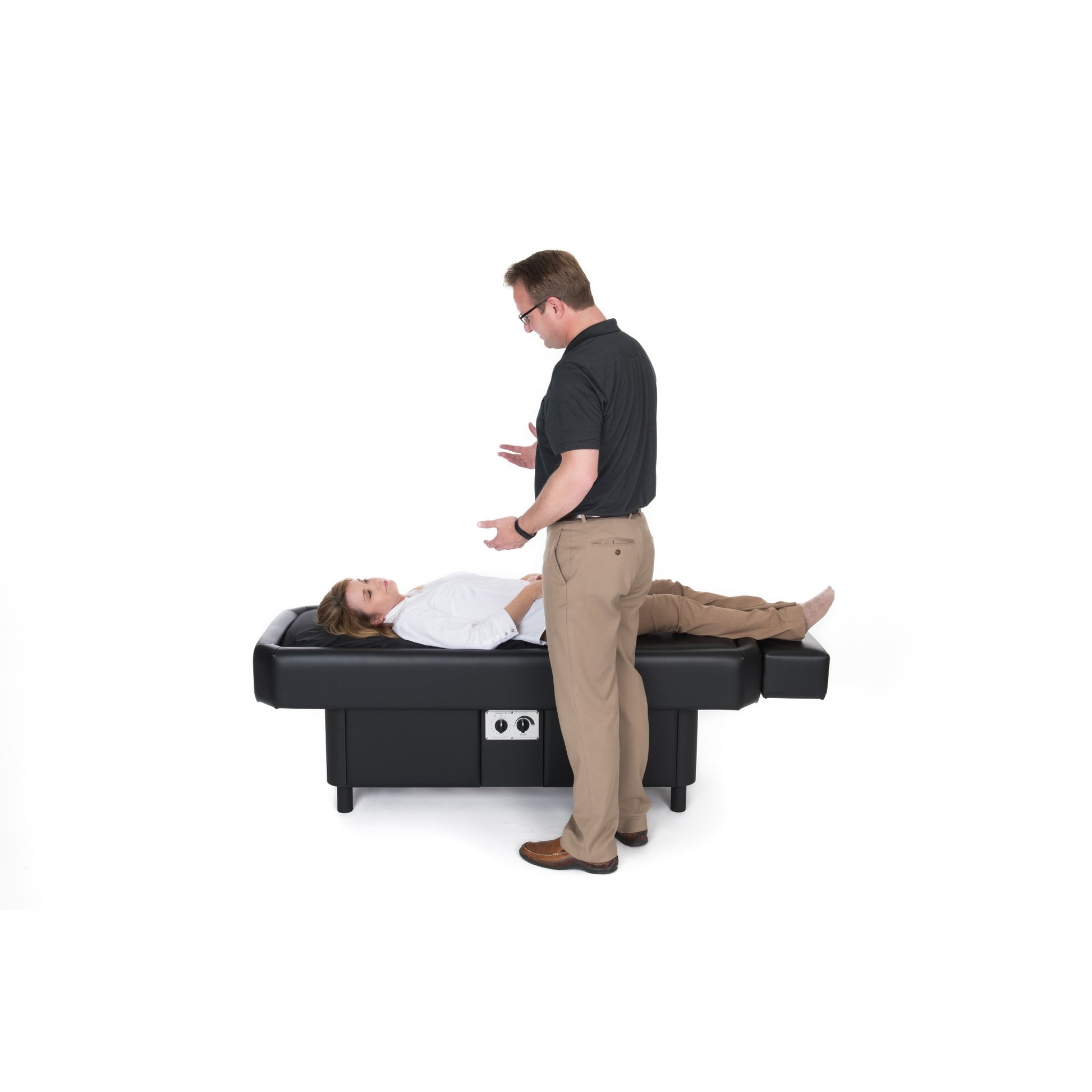 Patient comfortably resting on Sidmar Pro S10 Hydrotable black finish in clinic