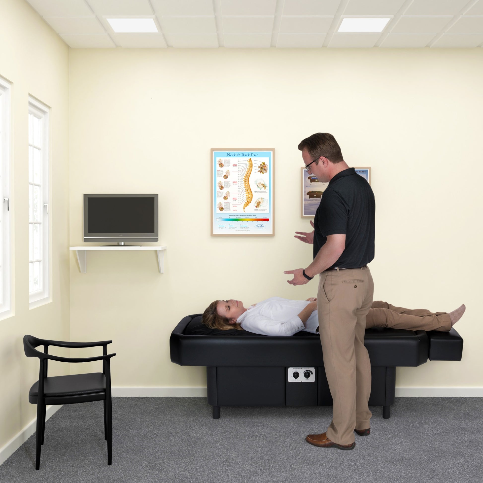 Practitioner assisting patient on Sidmar Pro S10 Hydrotable black finish in clinic