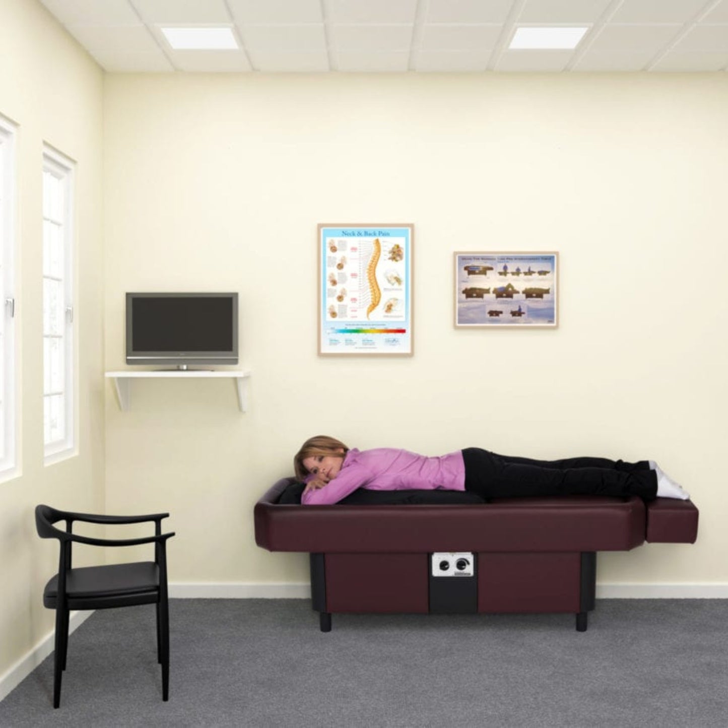 Sidmar S10 Hydrotable instructional poster displayed on clinic wall above massage table