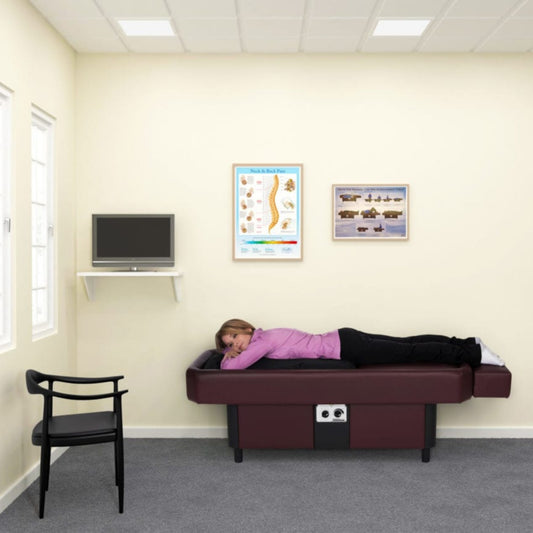 Sidmar S10 Hydrotable instructional poster displayed on clinic wall above massage table