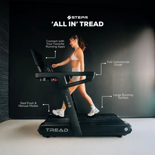 Woman sprinting on STEPR All-In Tread XL treadmill for speed training