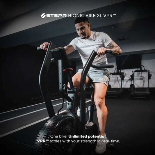 Athlete training on STEPR Bionic Bike XL air bike for endurance workout