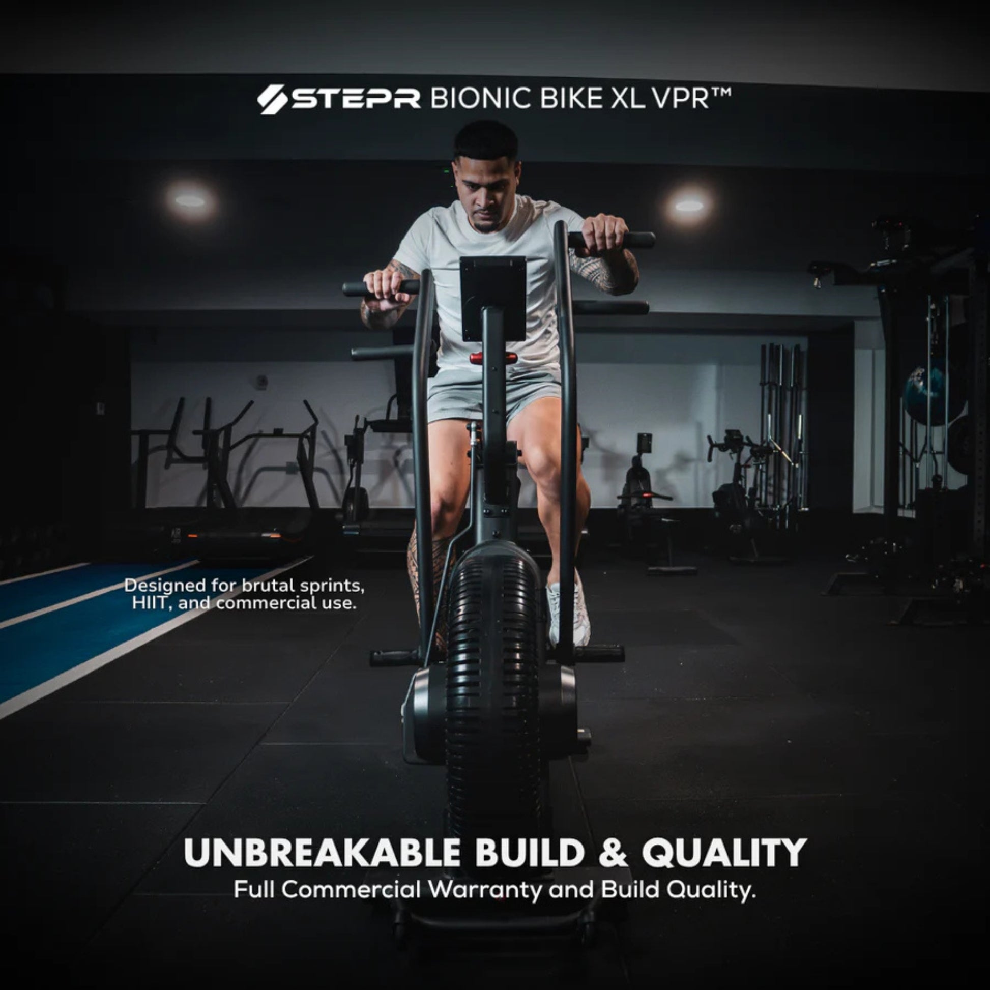 Woman exercising on STEPR Bionic Bike XL air bike in gym setting