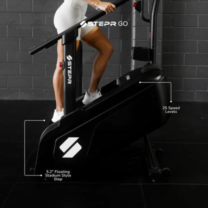 Woman training on home stair climber in lifestyle gym environment