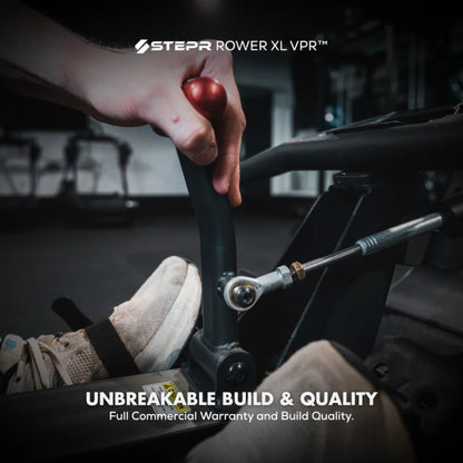 Close-up of STEPR rowing machine resistance control knob for adjustments