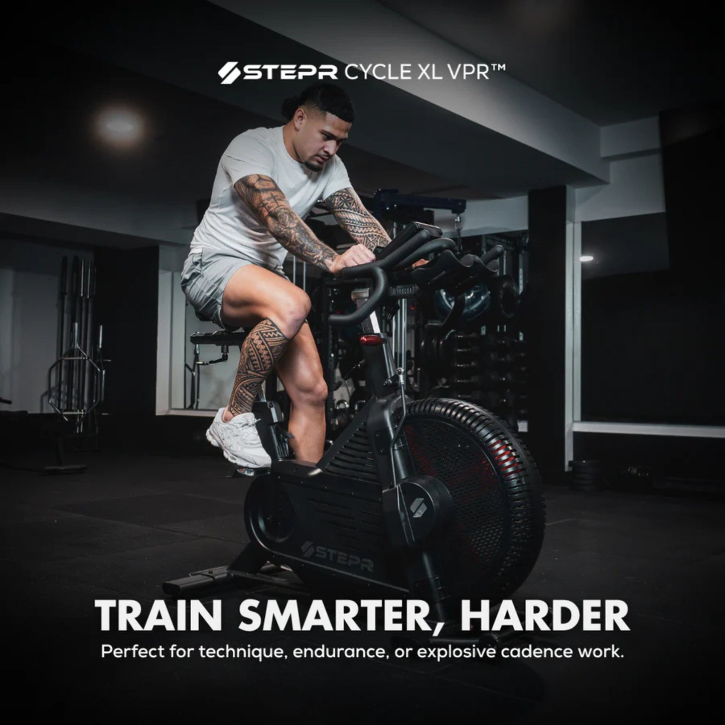 Athlete using STEPR spin bike for endurance and strength training indoors