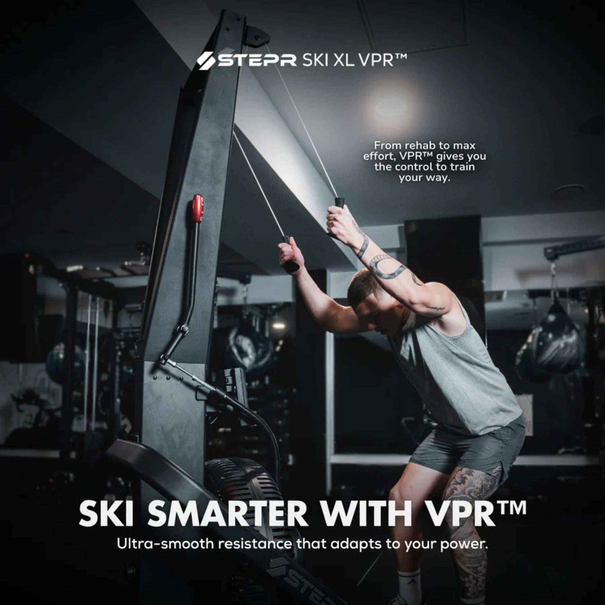 Man training shoulders on STEPR vertical climber machine in fitness studio