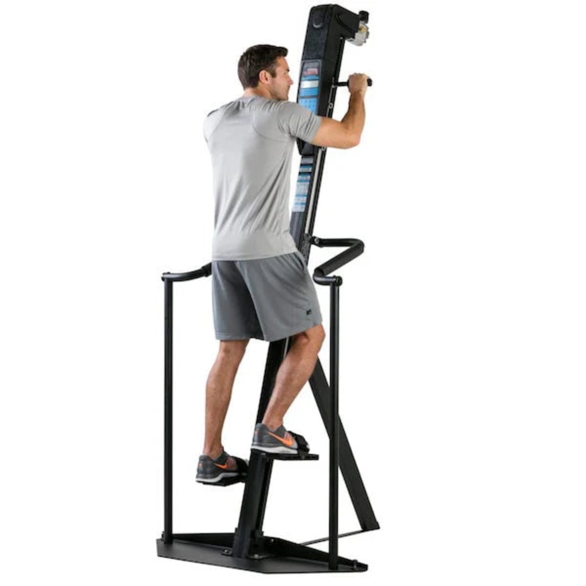 Man exercising on the VersaClimber ALX vertical climbing machine, demonstrating full-body zero-impact cardio and strength training on a white background