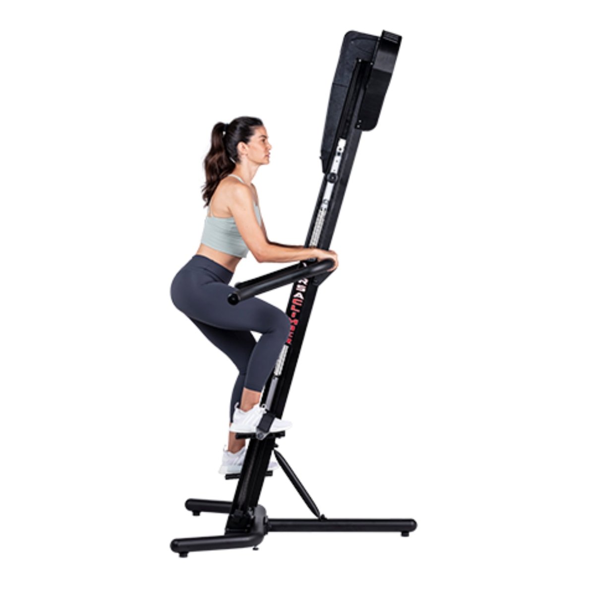 Woman exercising on the VersaClimber SM-M Magnetic in regular black finish, demonstrating full-body zero-impact cardio and strength training.