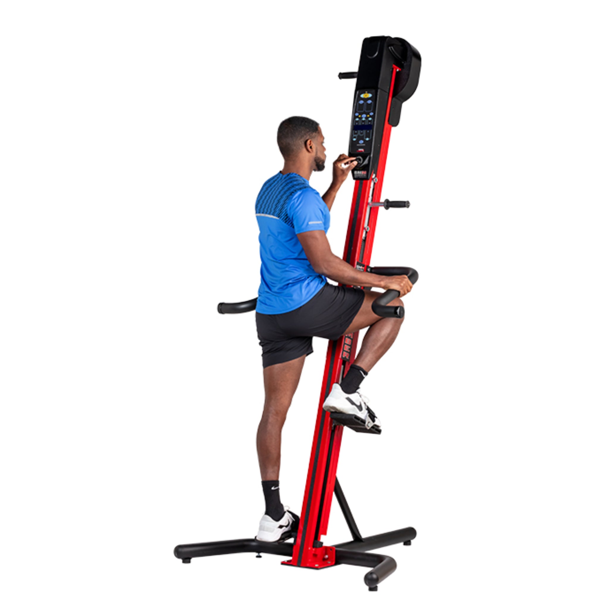 Man exercising on the VersaClimber SM-M Magnetic in red and black finish, demonstrating full-body zero-impact cardio and strength training.